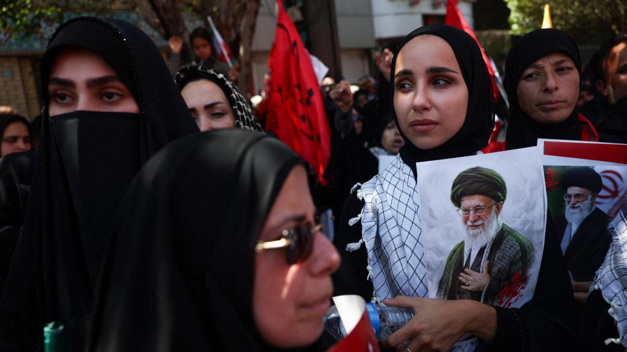 Huge crowds in Mashhad as Iran's late supreme leader is buried