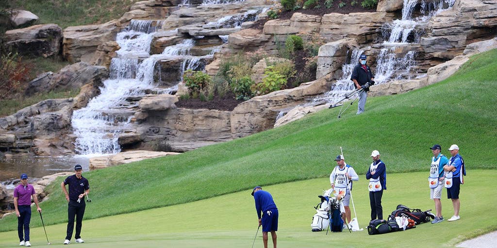 Golfers appear to launch cart off cliff and land in the water at course in Missouri designed by Tiger Woods