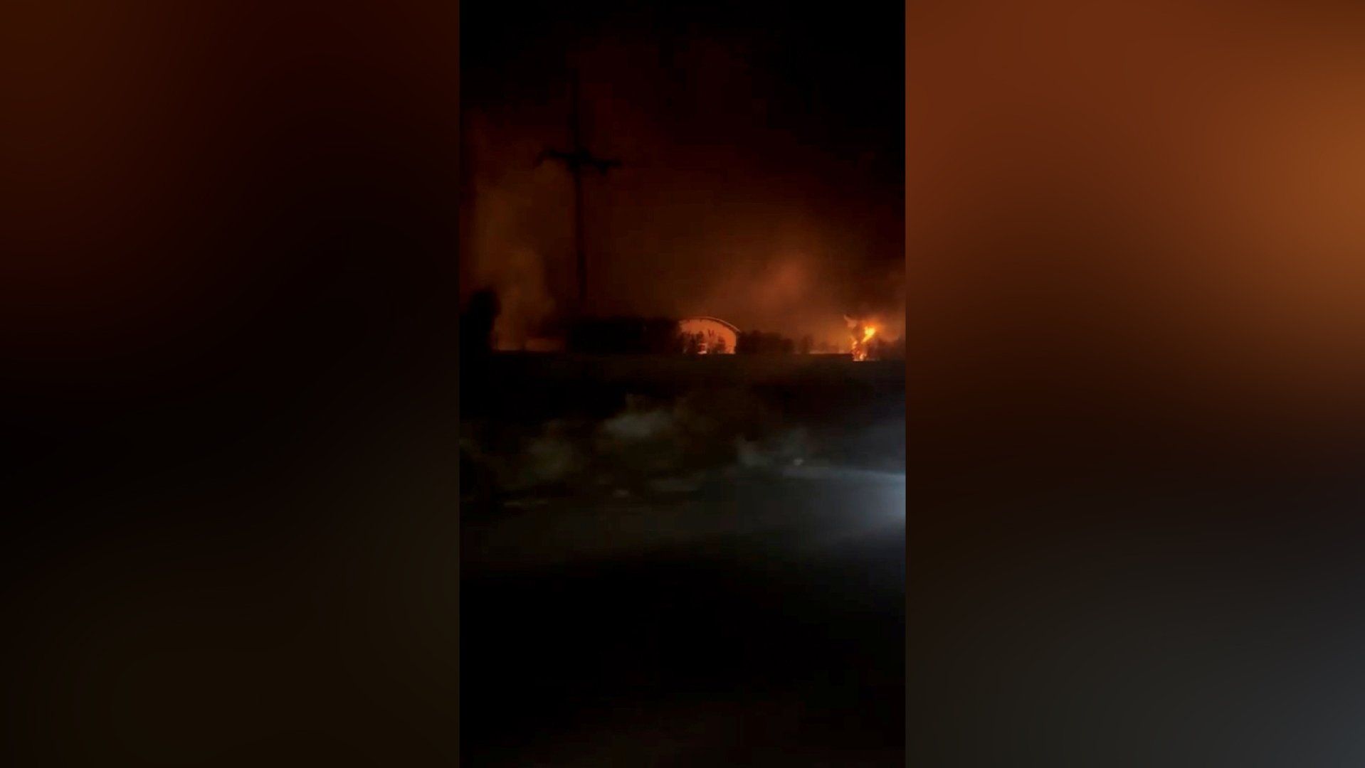 Air defences activate in Iran and flames rise from US attacks