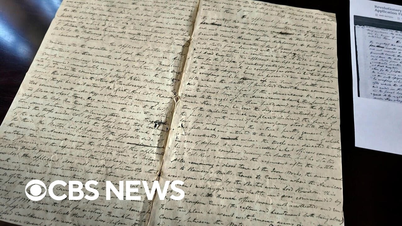 Volunteers deciphering first-person Revolutionary War accounts written in cursive