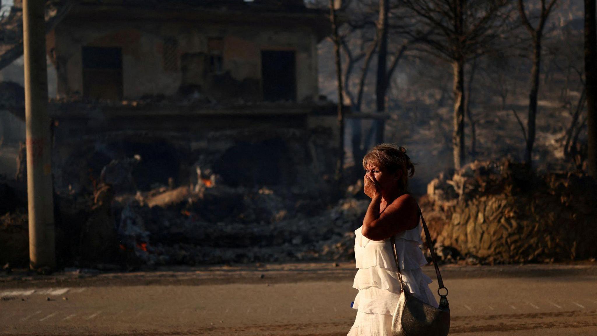 Two dead and hundreds evacuated after twin fires break out on Greek island