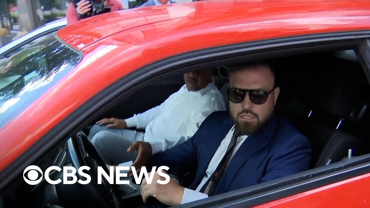 Watch: Lawyer hits car while trying to escape reporters outside courthouse