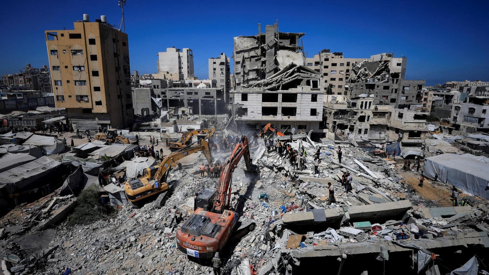 Eight children among 21 killed after war-damaged Gaza building collapses, rescuers say