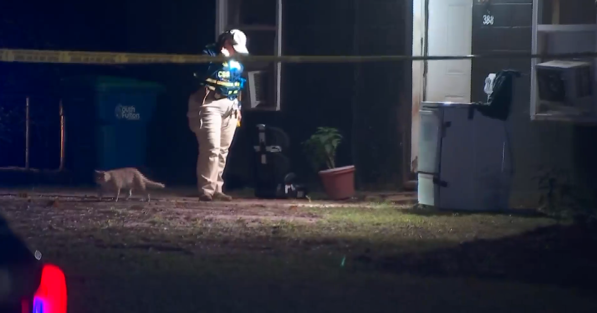 Georgia officer fires at charging dogs and wounds resident, police say – CBS News